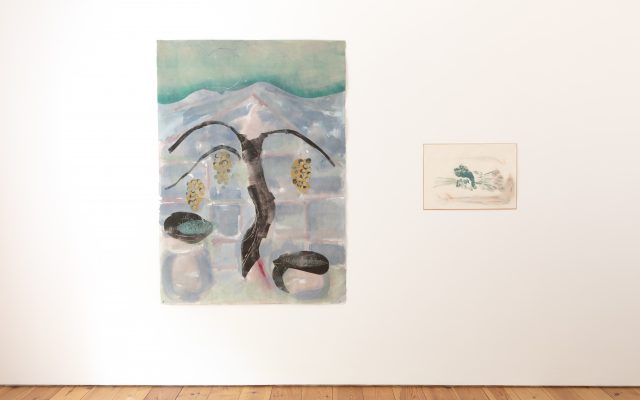 Two of Lotte Gertz’s prints hanging in Cample Line’s upper gallery. On the left is the relief print, ‘Children, compost, seedlings’ (2025), depicting an abstract black tree with orange and grey grapes hanging from its branches. On the right is the printwork and watercolour, ‘Repair’, depicting an abstract, horizontal hand grasping a bundle of flowers in teal and pink colouring.